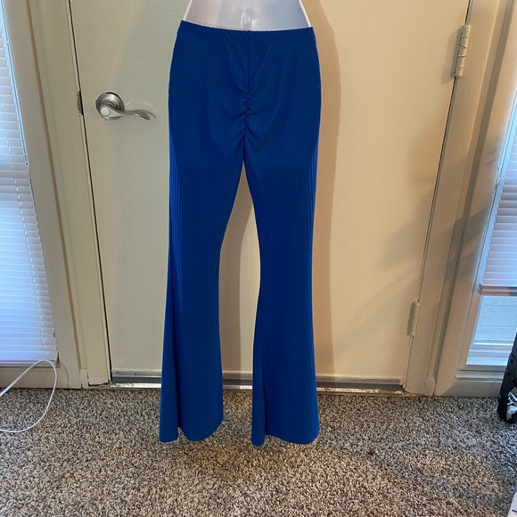 Blue high waisted stretch pants with cinched butt. - Picture 2 of 3